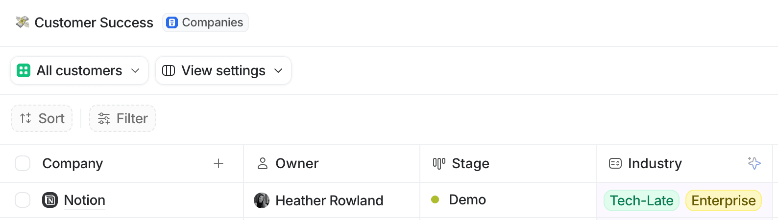 Attio table view showing customer details with columns for Company, Owner, Stage, and Industry. Includes filter and sort options.